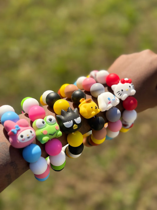 Kitty & Friends Keychain Silicone Wristlets on blurred background