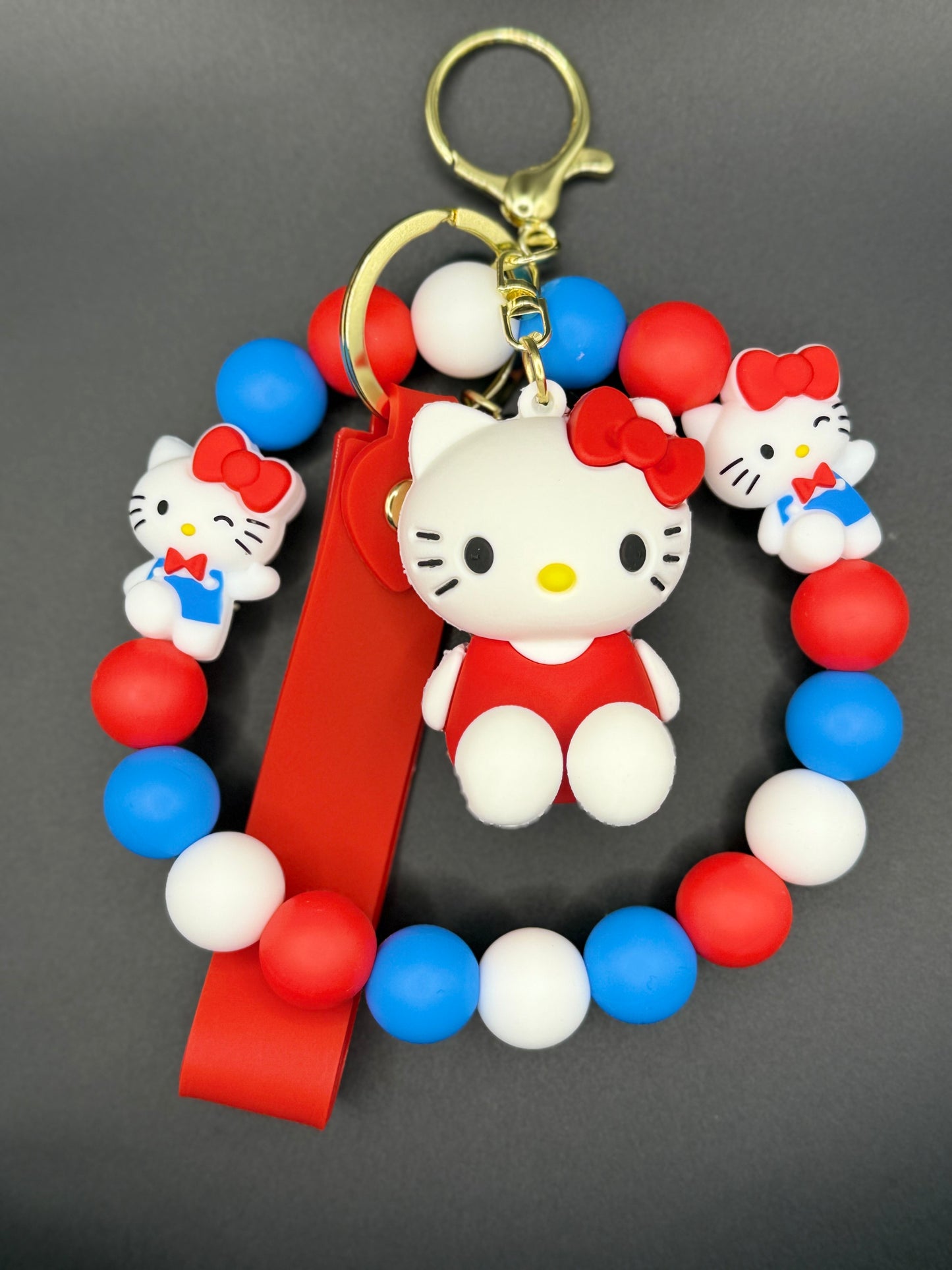 Colorful keychain with a character design on a gray background